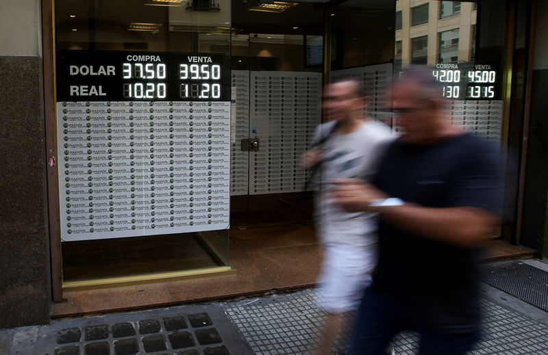 Argentina's billion-dollar buying spree reins in peso, rates
