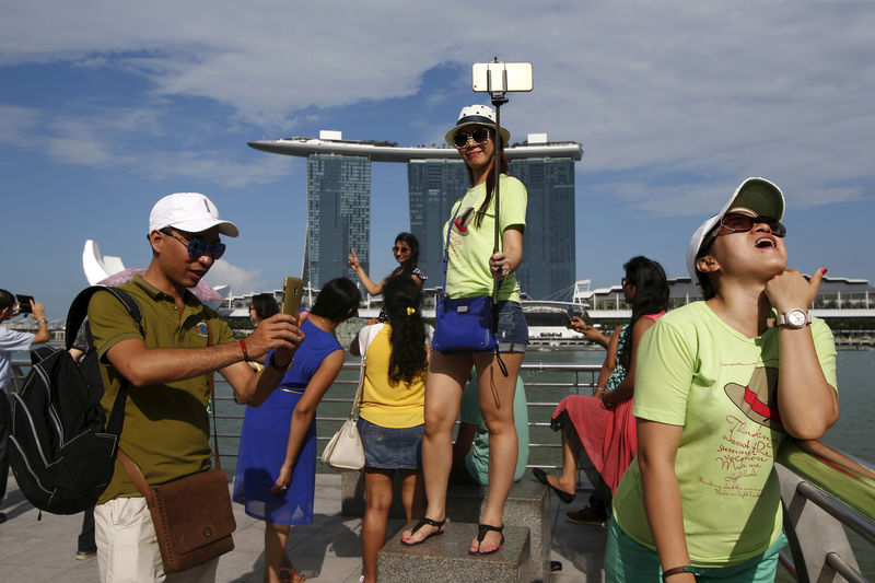 Visitor arrivals to Singapore climb to record high