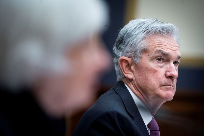 Fed lays out plan to reduce bond purchases, flags inflation worries