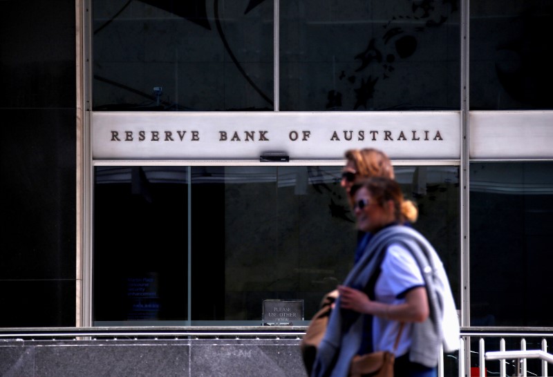 Australia central bank sees challenging economy, inflation risks