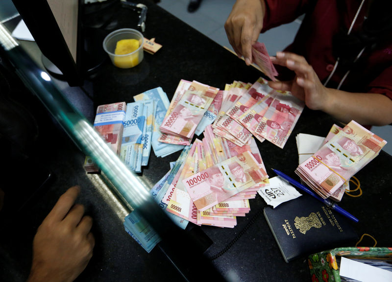 As currencies weaken, Asia