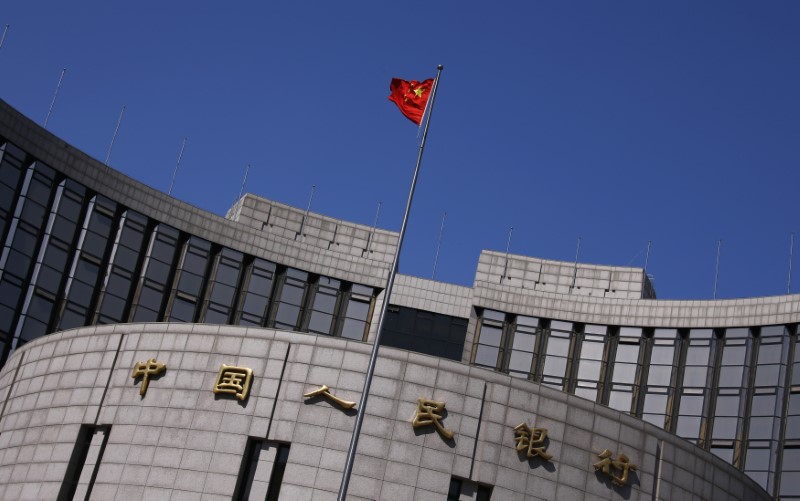 As trade war looms, China cuts some banks