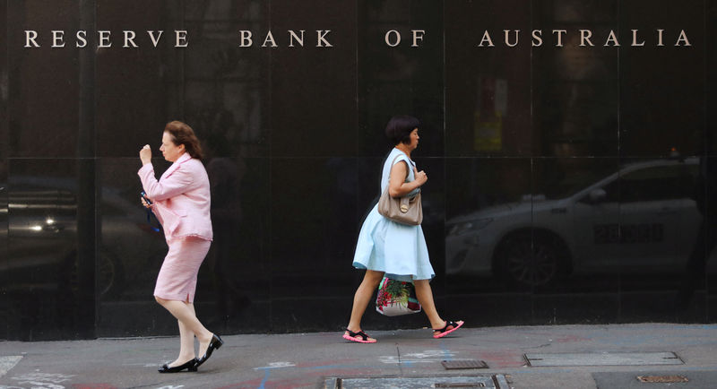 Australia central bank holds rates; low inflation, tighter credit to prolong easy stance