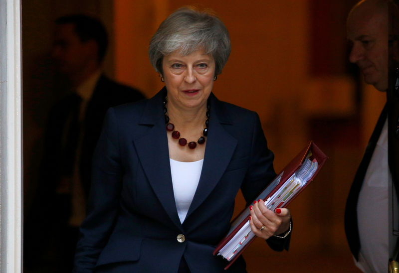 British PM hails Brexit deal but must sell it to doubtful ministers