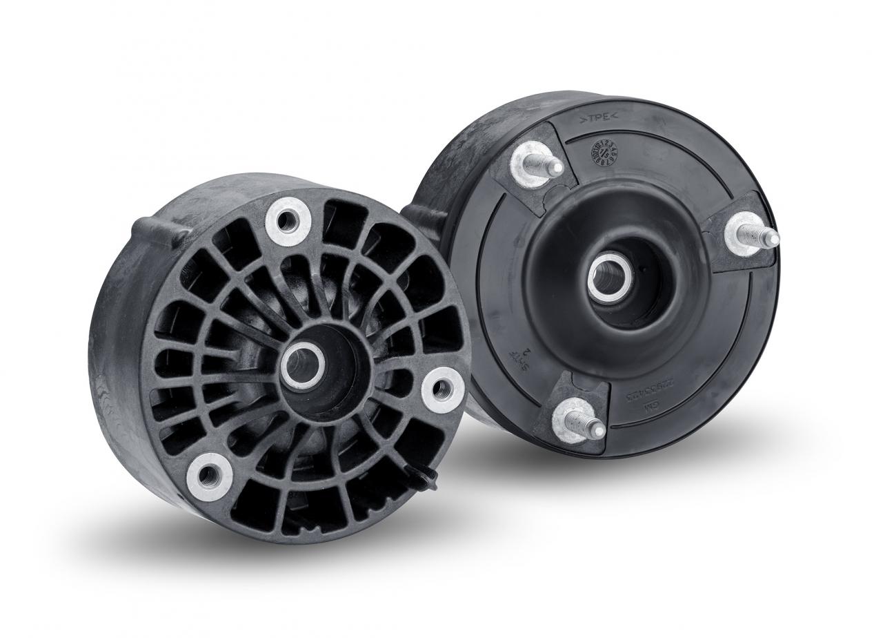 Cadillac uses nylon as primary strut mount component Cadillac uses nylon as primary strut mount component