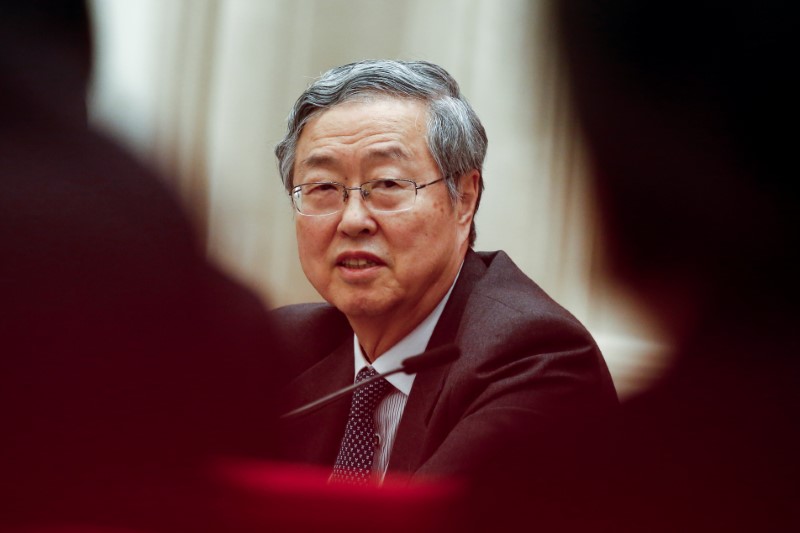 China central bank governor says to control systematic risks