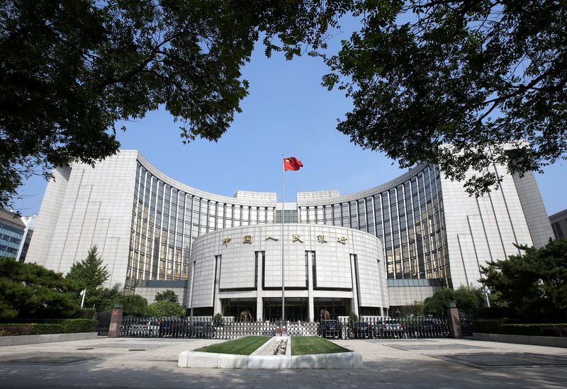 China central bank pledges more policy support as bank lending slides