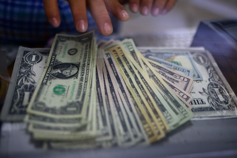 Dollar eases as China deflation lures investors into risk assets