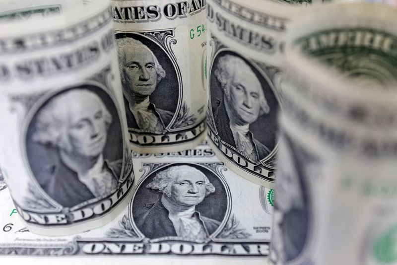 Dollar edges up as Fed