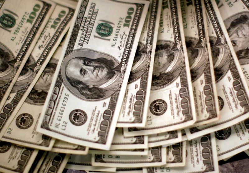 Dollar on solid footing into Fed decision; yen dips on LDP victory