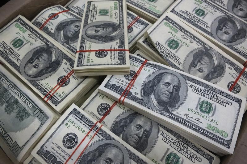 Dollar slips from two-month high; Fed rate expectations in focus