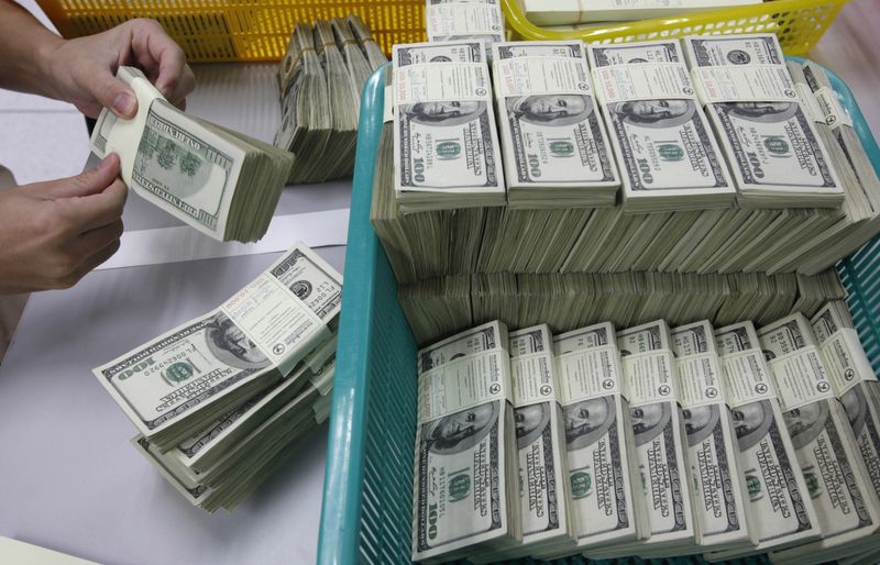 Dollar under pressure on rate cut wagers in thin holiday market