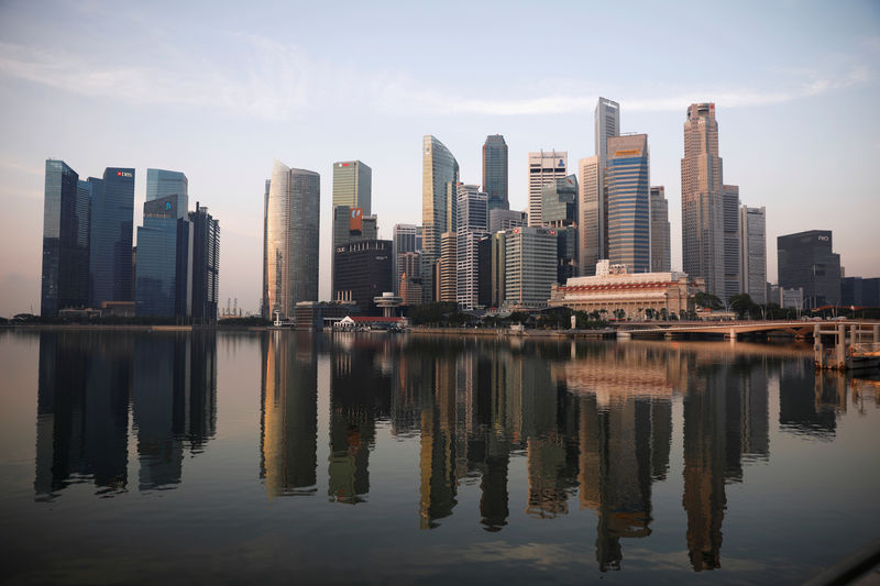 Economists again trim forecast for Singapore