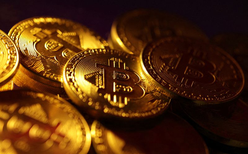 Ether jumps, bitcoin holds gains after ETF regulatory approval