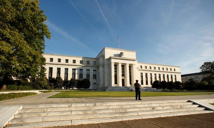 Fed leaves interest rates unchanged, says inflation near target