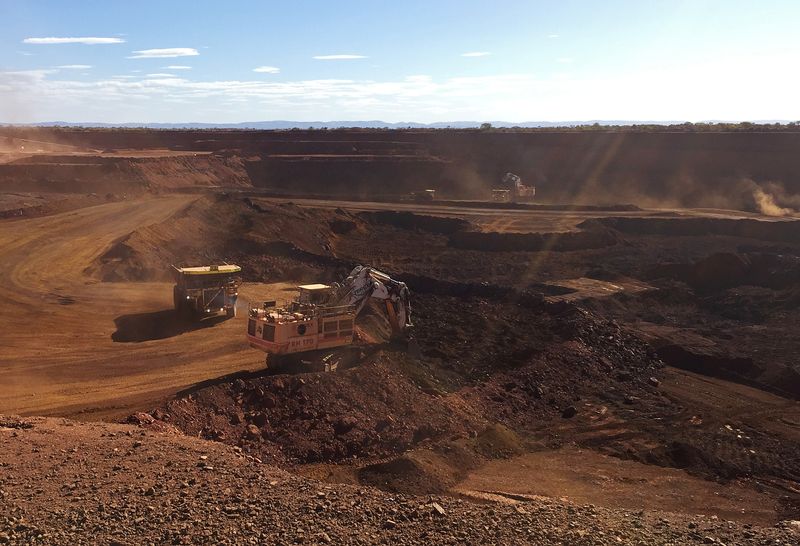 Fortescue works to clear iron ore held in China as quarterly shipments rise