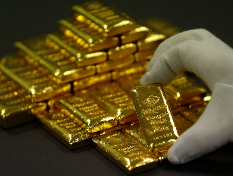 Gold soars toward largest annual gain since 2010 on dollar boost