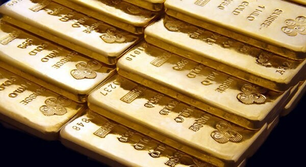 Gold set for third monthly rise on softer dollar