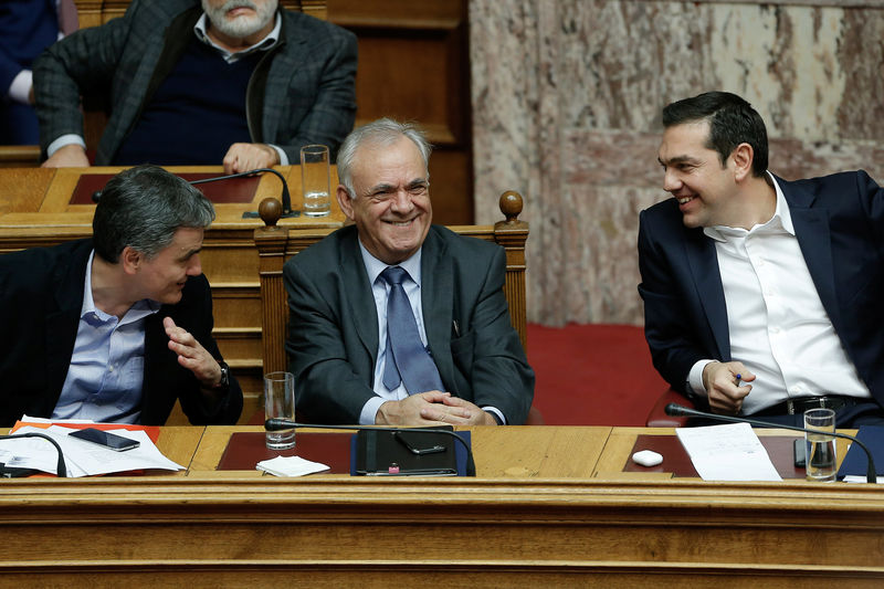 Greek lawmakers approve 2018 budget, government says last under bailout