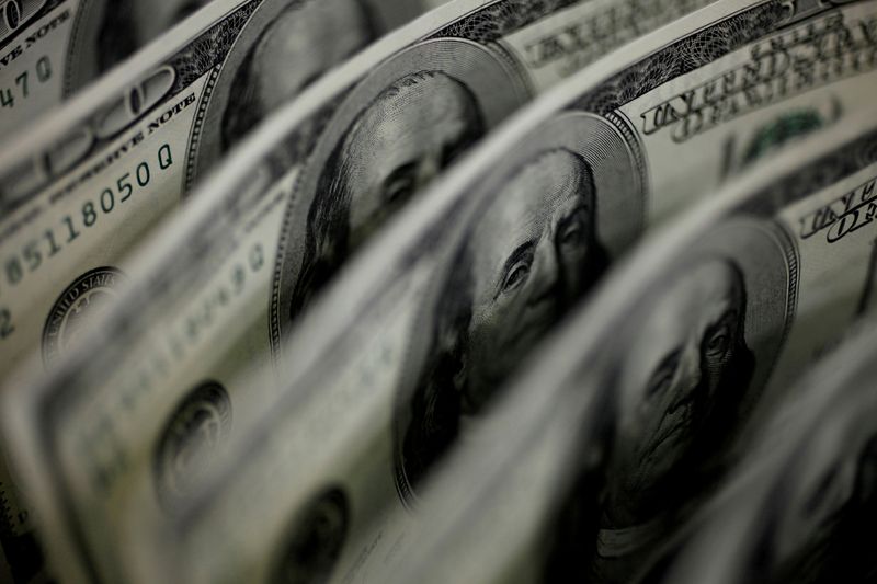 Dollar weighed down by US default risks; Aussie, yuan hurt by weak China data