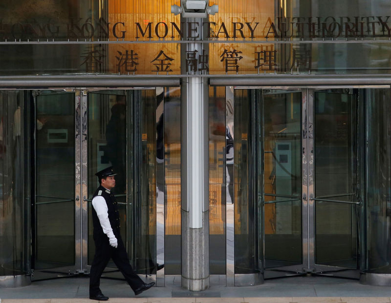 Hong Kong tracks Fed hike but flags risks from trade