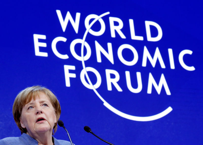 In Davos, Merkel says isolation not the answer