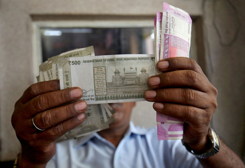 Indian rupee seen facing more punishment, but no new record low: Reuters poll