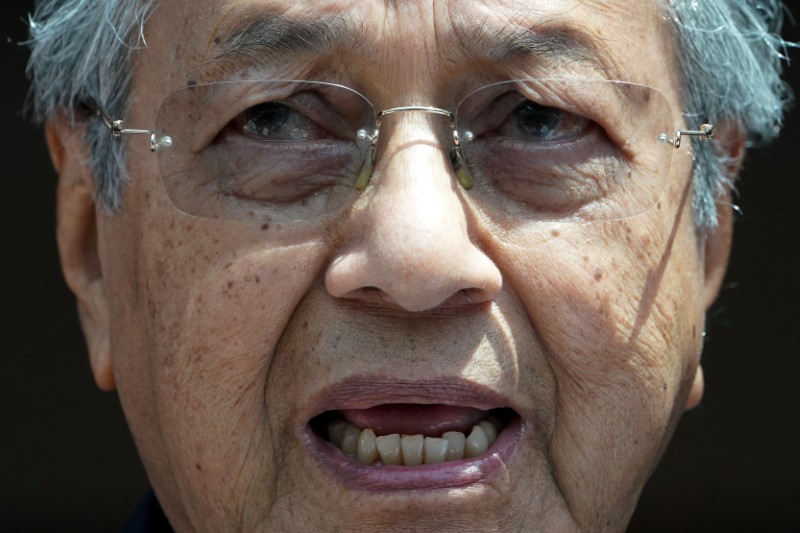 Inheriting slowing Malaysian economy, Mahathir makes tax changes