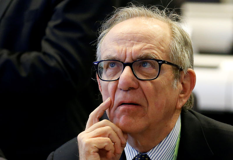 Italy Economy Minister says tackling bad loans too quickly would hurt banks