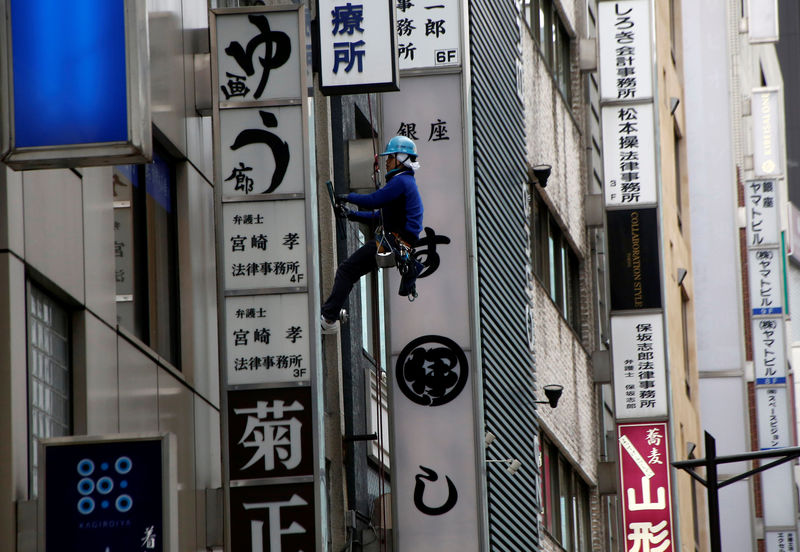 Japan fourth-quarter GDP growth revised up, BOJ seen in no rush to exit debate