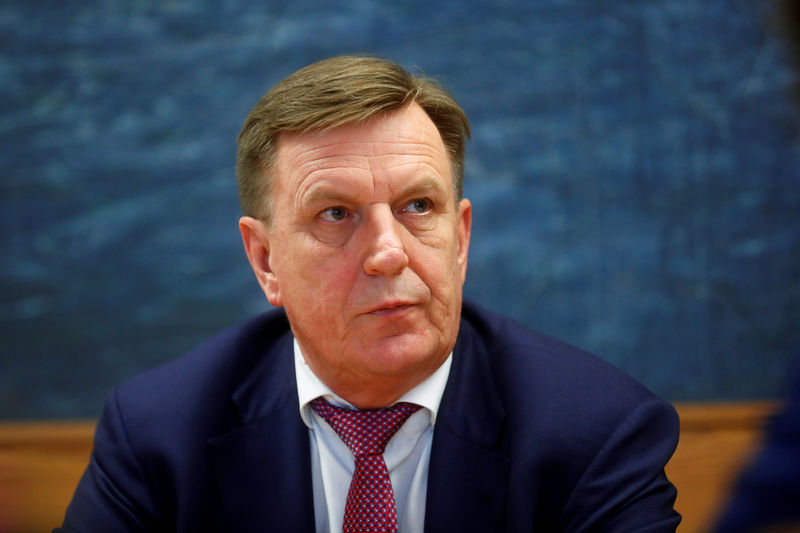 Latvia PM pledges tighter bank controls to defuse U.S. standoff