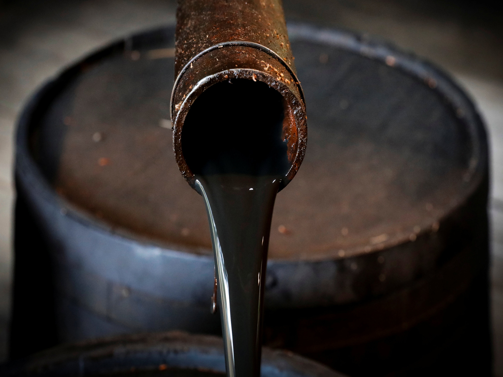 Oil breaks above  a barrel as shadow of trade war recedes