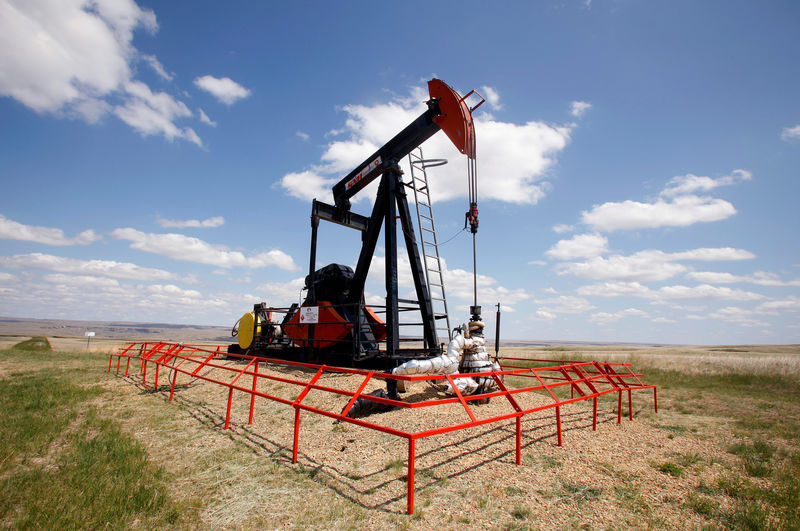 Oil prices dip as U.S. crude output hits record 12 million barrels per day