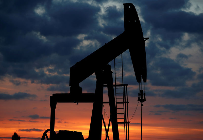 Oil prices edge up, but set for weekly loss on stock build, trade row