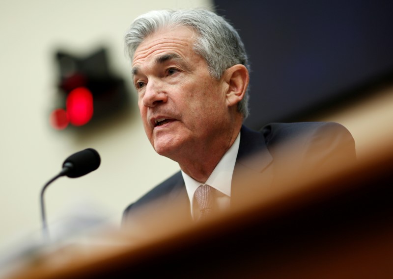 Fed raises rates, signals confidence in strengthening economy