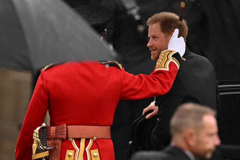 Prince Harry takes a seat at King Charles