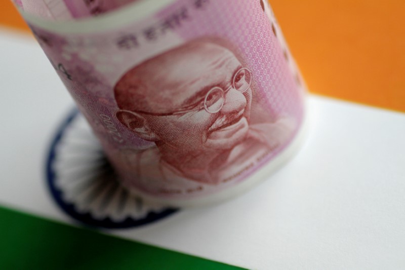 Rupee and rupiah seen vulnerable to U.S. rates, tantrums not expected