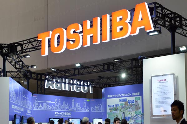 Toshiba sues former executives over scandal, swings to operating loss