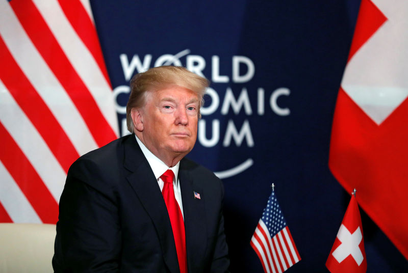 Trump confronts Davos on trade abuses, talks up dollar