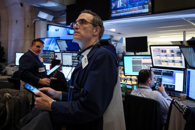 Wall St slides as oil prices surge, Nasdaq confirms bear market