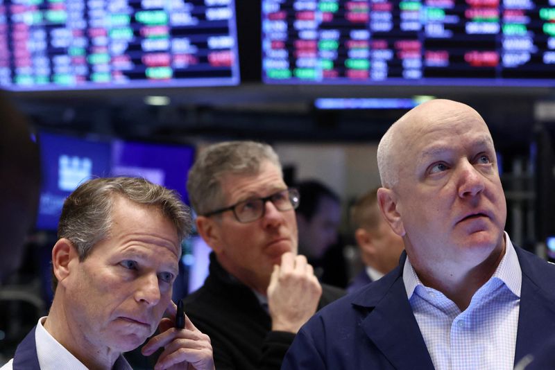 Wall Street down but off session lows after Fed rate hike, trading choppy