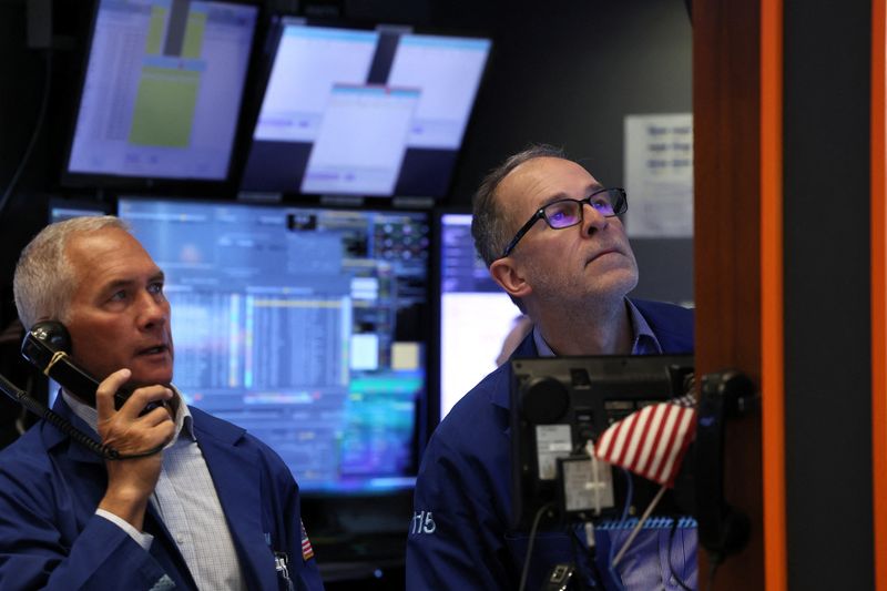 Wall Street falls with interest rates, earnings in focus