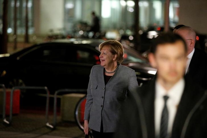 Weakened Merkel begins fourth term beset by challenges