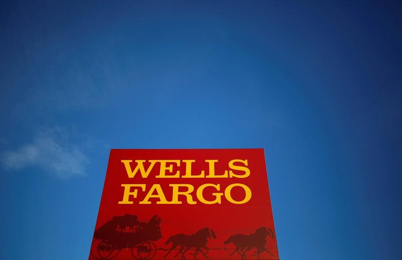 Wells Fargo sees no end yet to sales scandal costs, gets tax boost