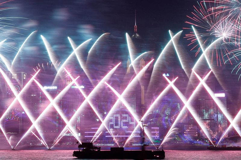 World welcomes New Year with fireworks, some stark words and a royal farewell