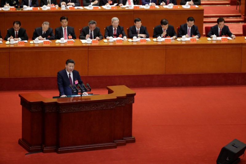 Xi says China will continue to open its economy, deepen financial reforms